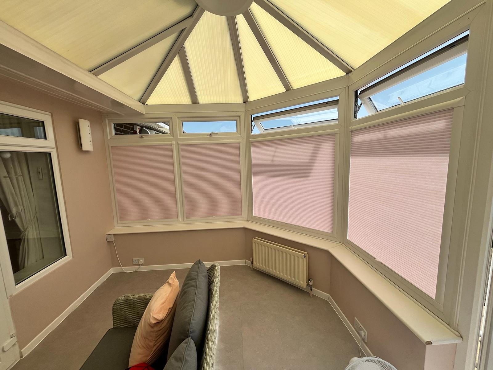 Pleated blinds in a conservatory