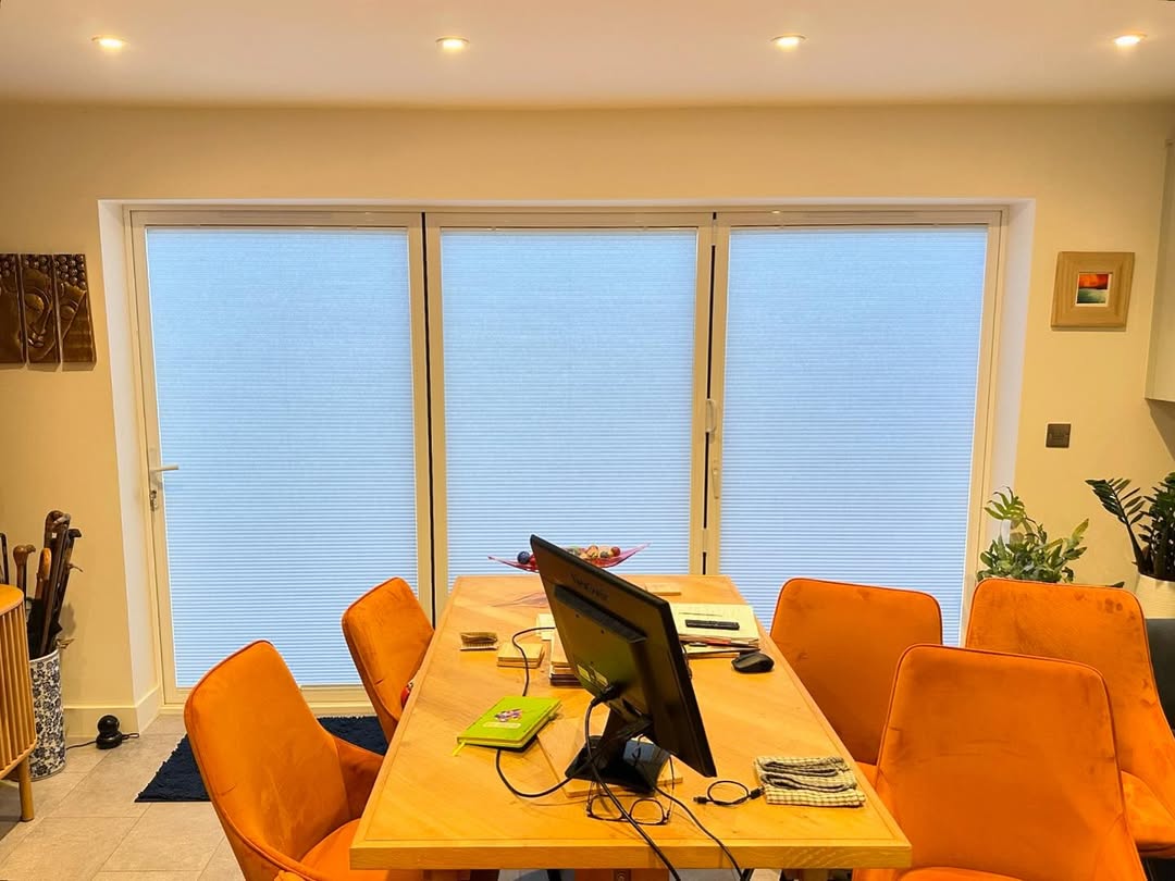 Pleated blinds on bi-fold doors closed