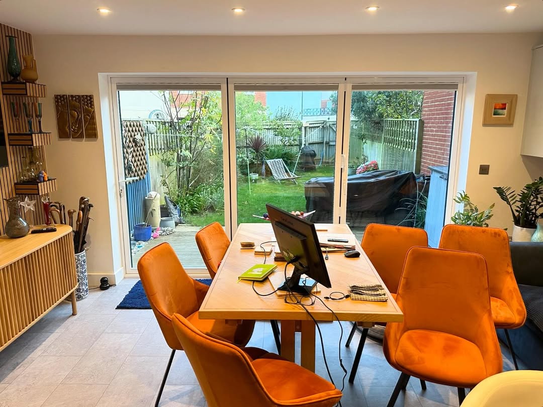 Bi-fold doors with pleated blinds open