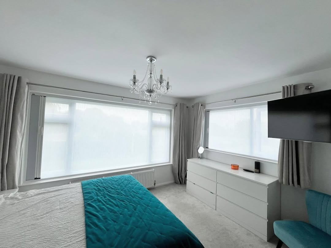 Roller blinds in a bedroom