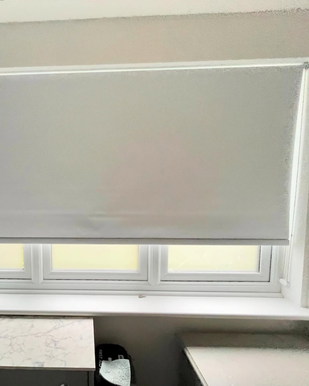 Grey roller blind close-up