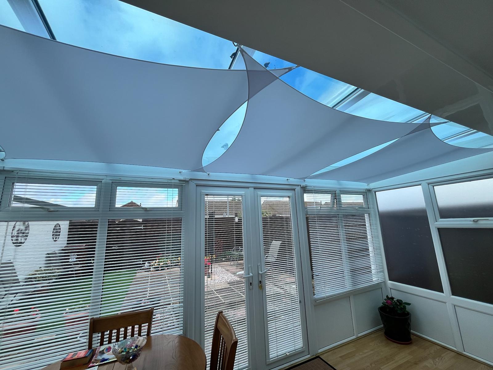 Shade sails fitted in a conservatory