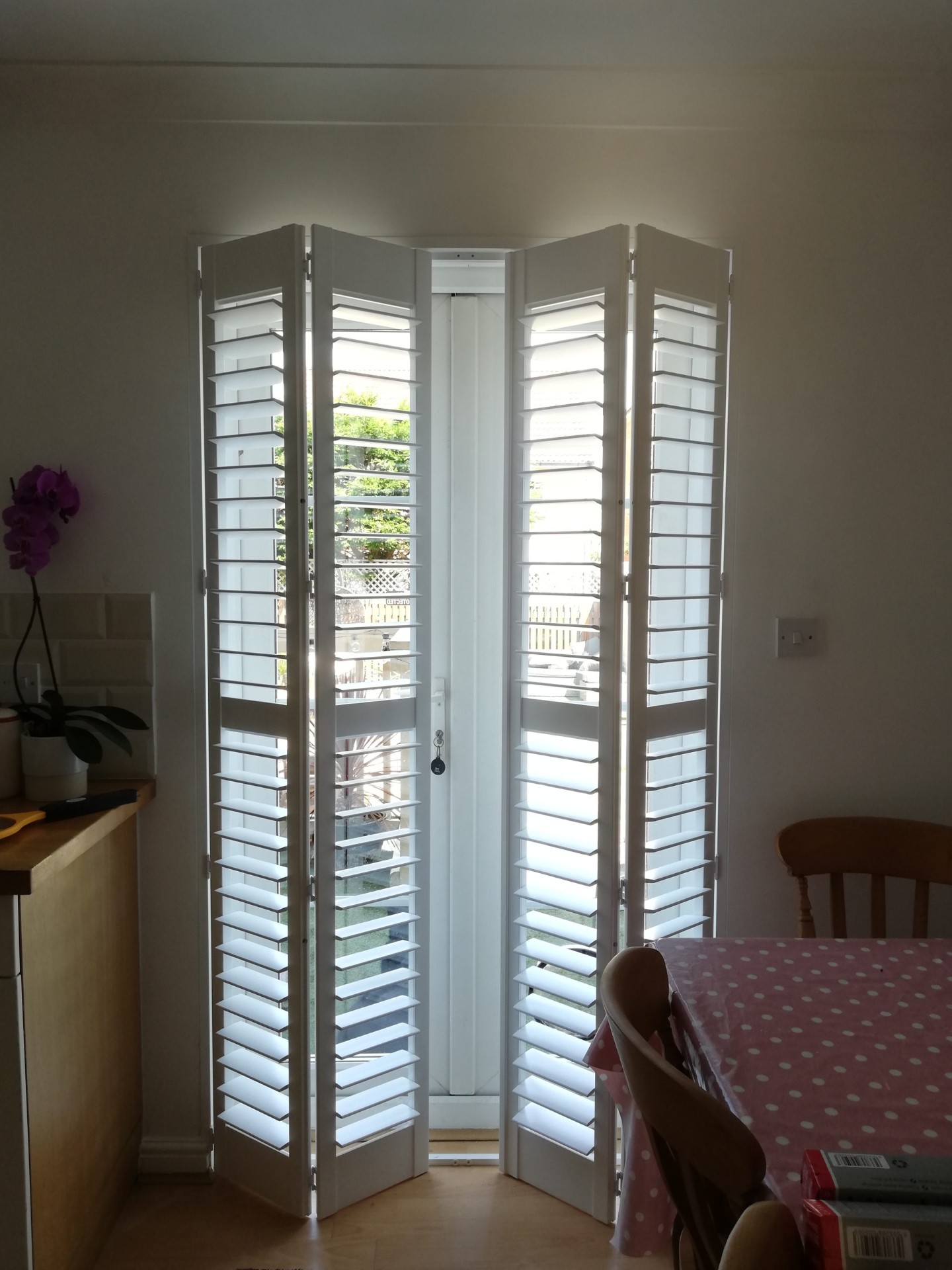 Bi-fold door shutters in kitchen