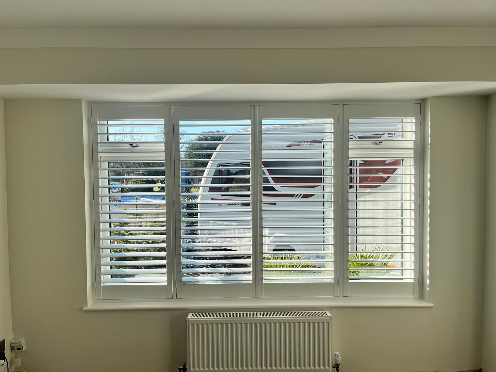 Wide cream shutters